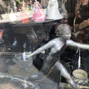 figurines of women in shop window